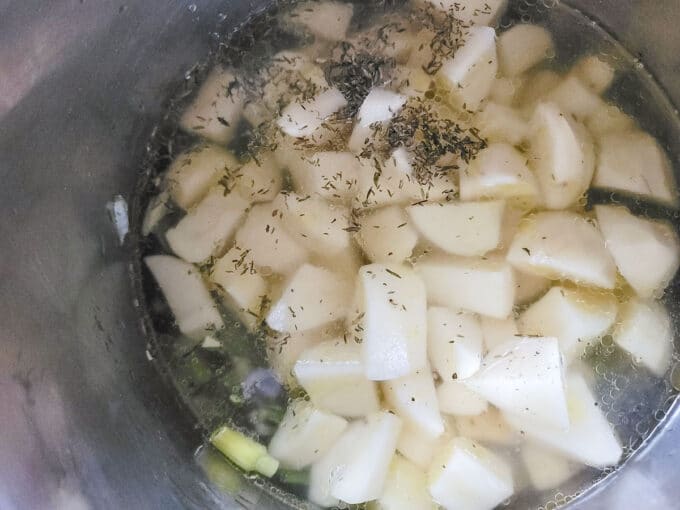 Vegetable stock or broth added to pot.