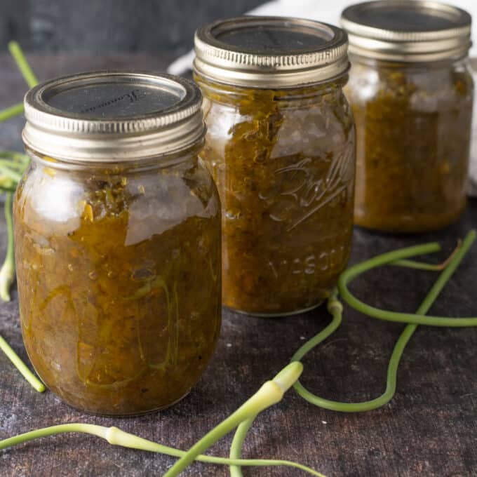 Garlic scape relish Pinterest image with text overlay.