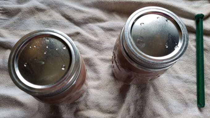 Lids and bands added to jars.