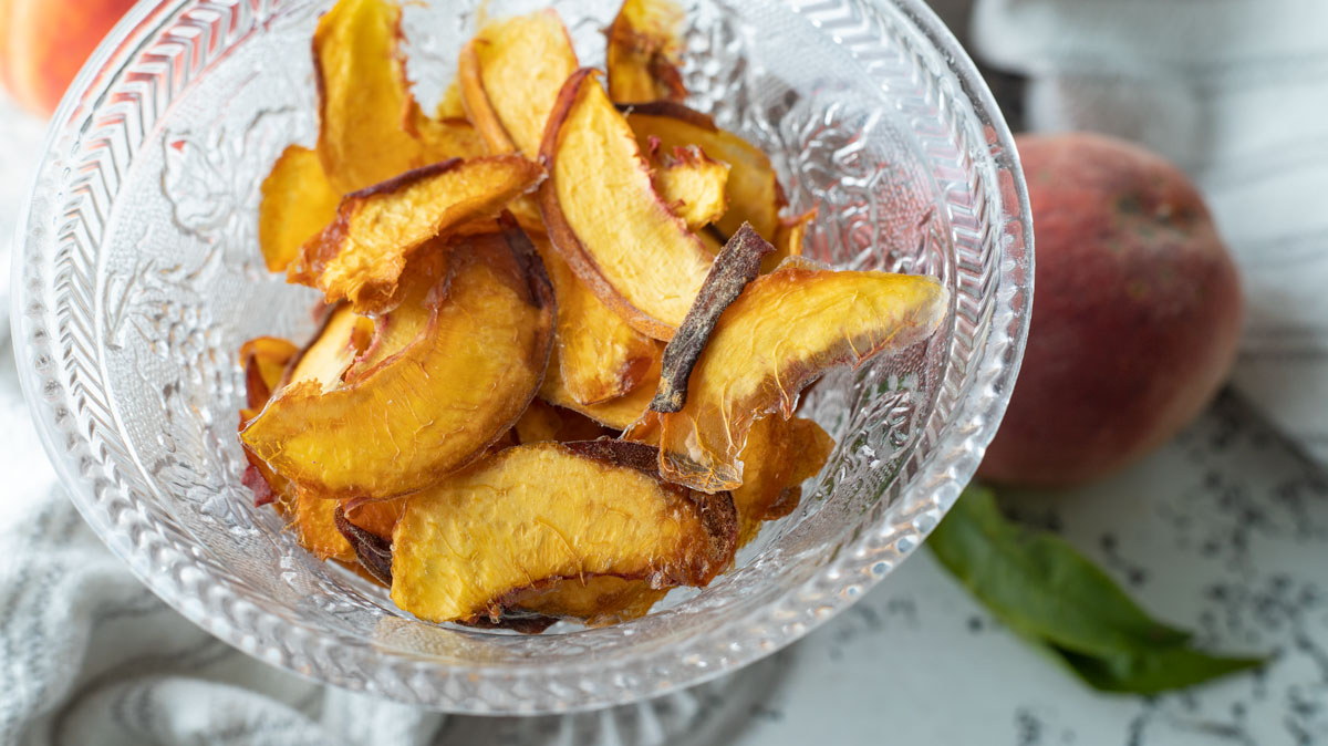 Dried peaches in crystal bowl.