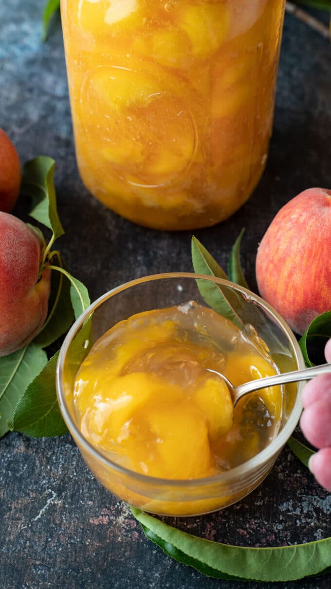 Small bowl filled with peach pie filling.
