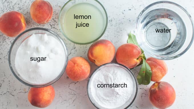 Ingredients to make canned peach pie filling.