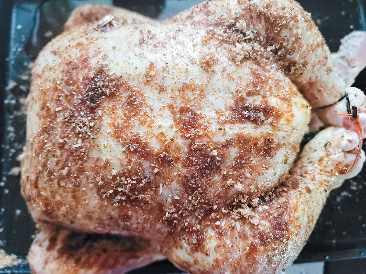 Dry rub applied to chicken.