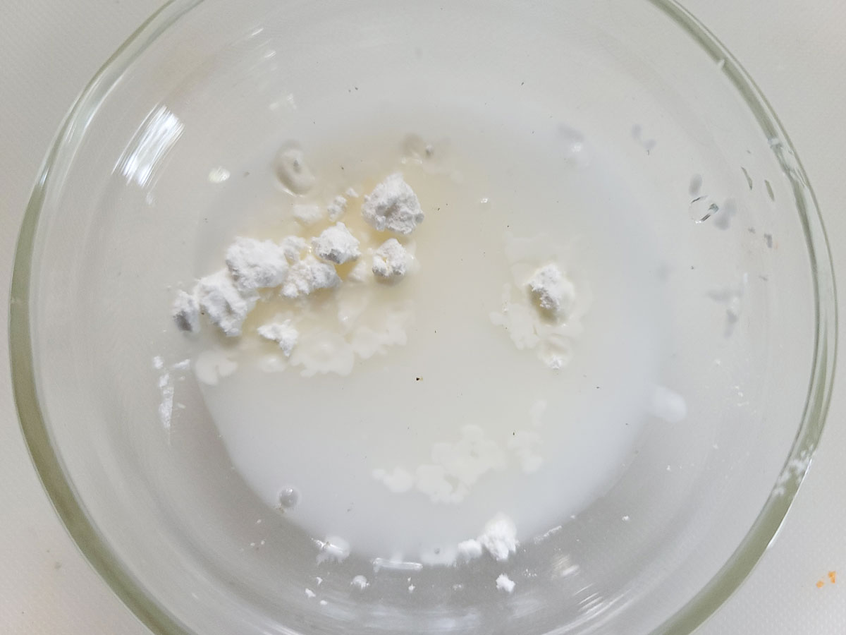 Cornstarch and water in a small bowl for a slurry.