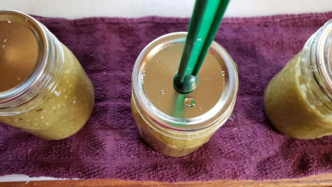 Lid placed on jar with jar lifter.