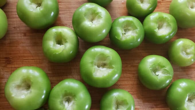 Cored tomatillos on board.