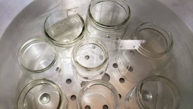 Jars in canning pot with water.