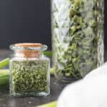 Dried scallions in decorative jars.