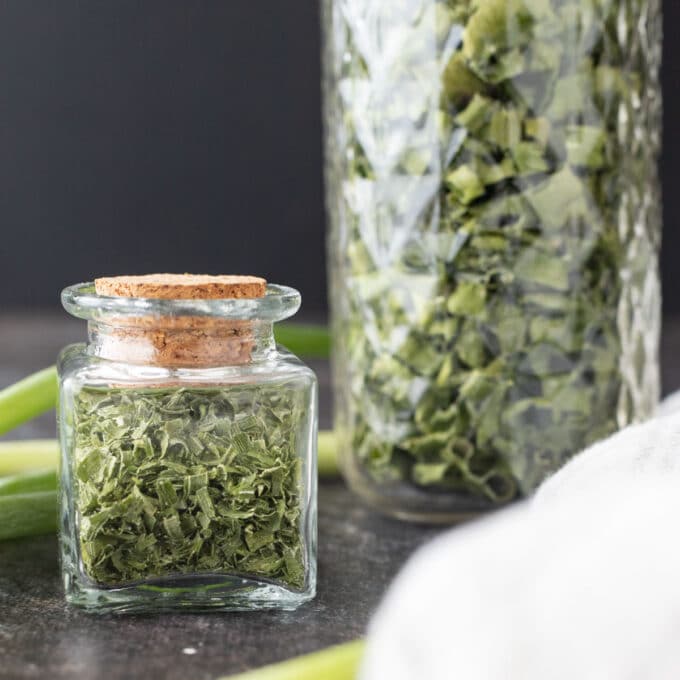 Dried scallions in decorative jars.