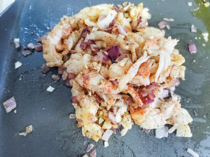 Mixed up lobster filling in pan.