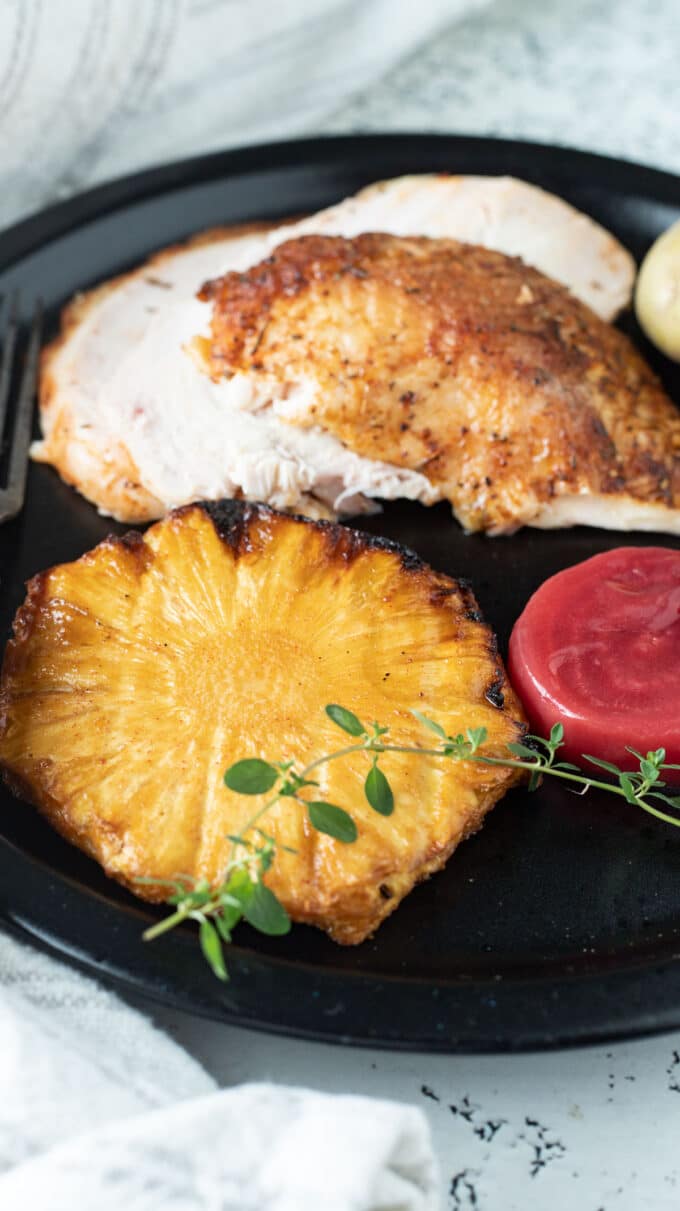 Plate with chicken, pineapple and beets.