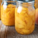 Sliced peaches in jars.