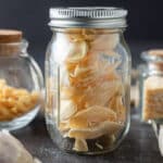 Dried garlic in glass jar.