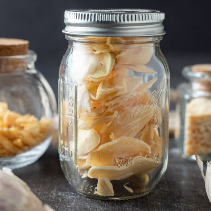Dried garlic in glass jar.