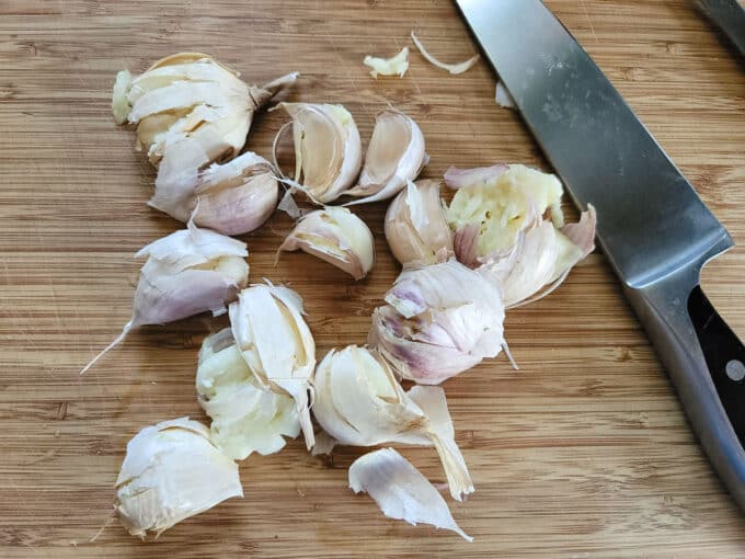 Crush garlic with skins on.