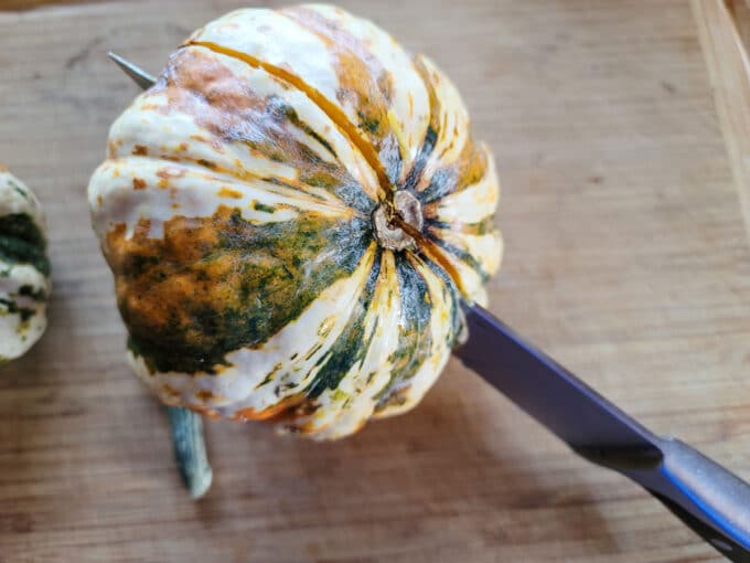 Underside of squash being sliced.