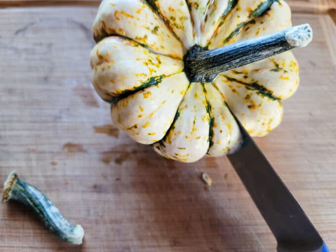 Slicing the other side of the squash.