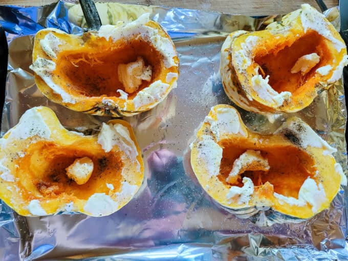 Scooped out squash spread with butter, salt and pepper.