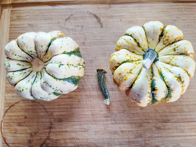 Squash on a board with stem removed.