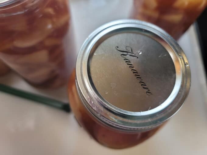 Band screwed onto jar.