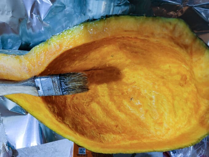 Basting squash with melted butter.