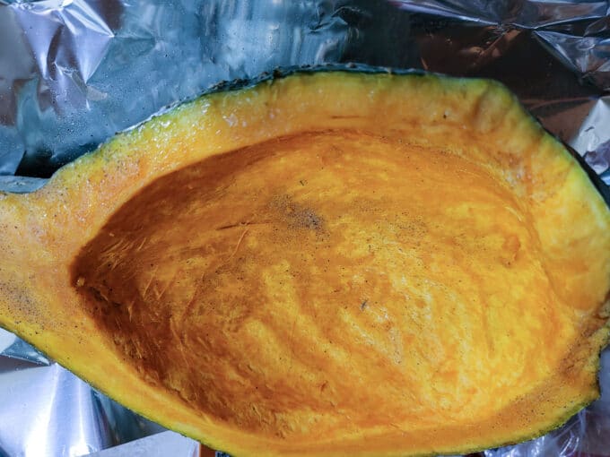 Inside of squash seasoned with salt and pepper.