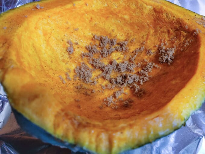 Brown sugar added to flesh of squash.