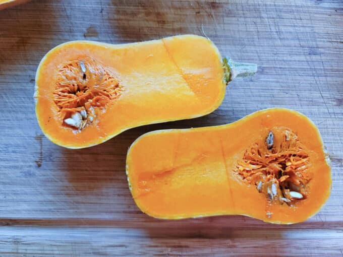 Halved squash with seeds still in it.