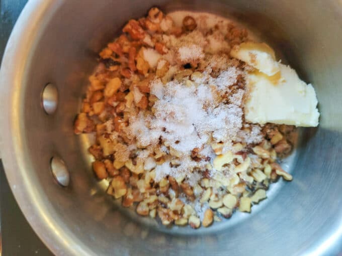 Walnuts, sugar and butter in small saucepan.