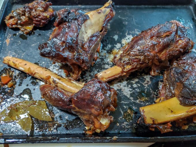 Browned shanks on rimmed baking sheet..
