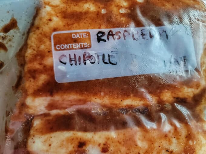Sealed, labelled bag with marinating pork belly.