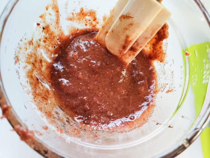 Curing paste in bowl with small spatula.