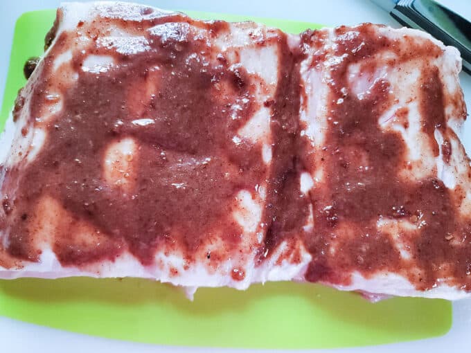 Paste slathered onto pork belly.