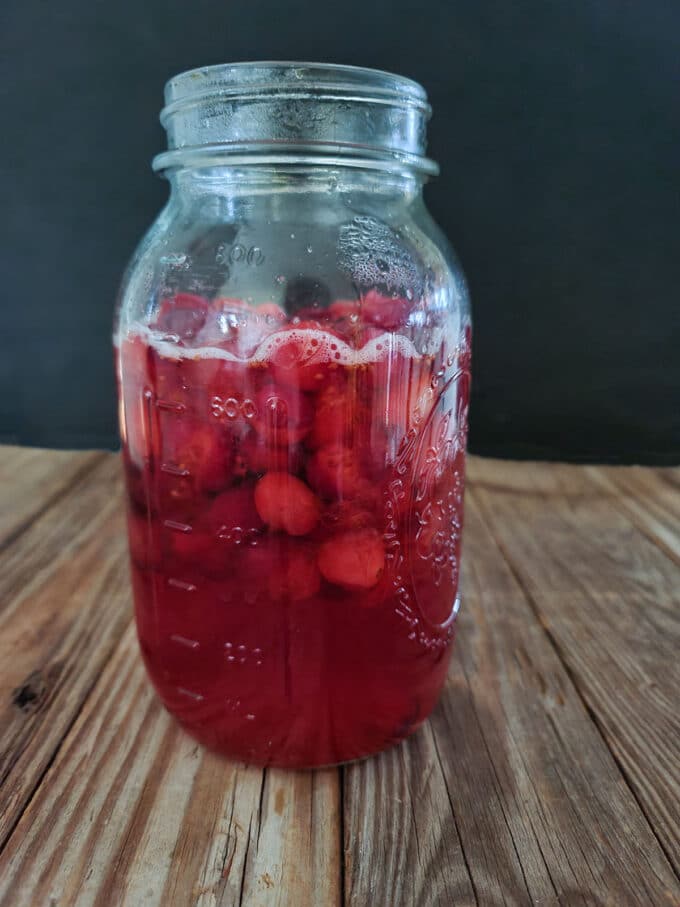 Cranberry vinegar in large jar steeping.