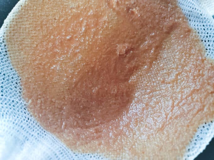 Sediment strained out with cheesecloth.