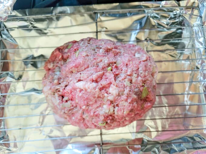 Mix meatloaf shaped into a loaf.