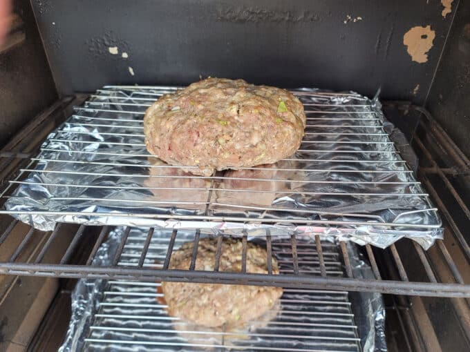 Meatloaf placed in on a rack in the smoker.