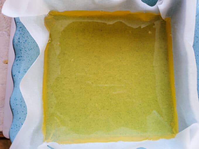 Liquid gold poured into parchment lined baking dish.