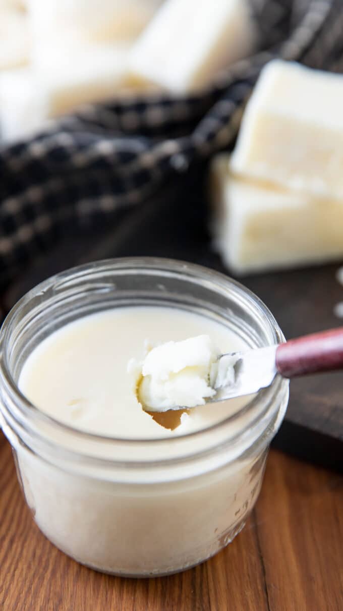 Spreading knife in a jar of tallow.
