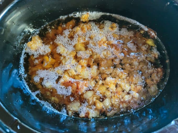 Bubbling fat in crockpot.