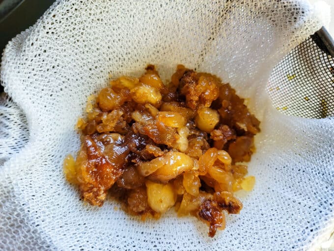 Strainer with cracklings in it.