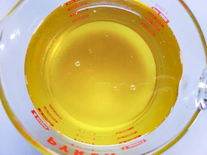 Beautiful yellow fat in measuring cup.