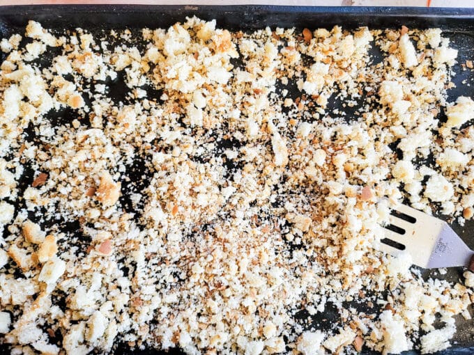 Small spatula flipping the crumbs.
