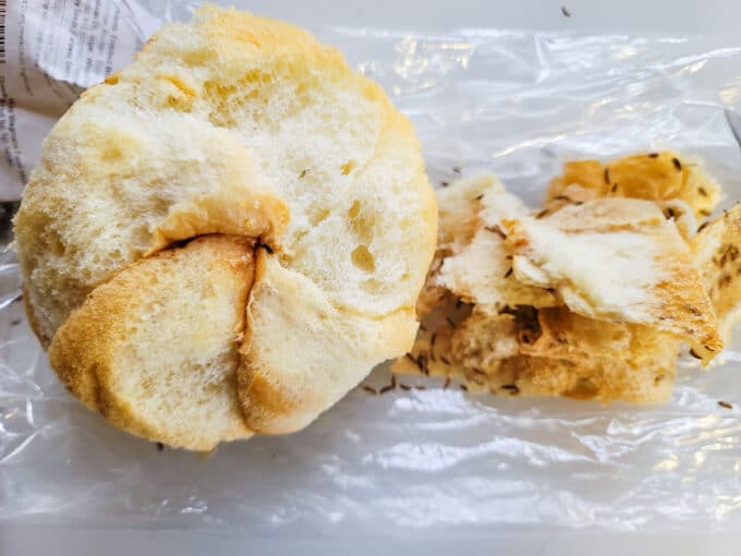 Crust removed from seeded roll.