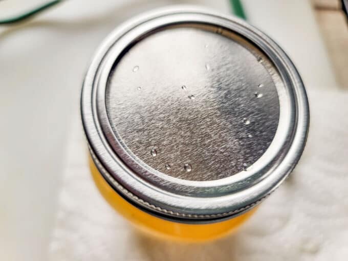 Band screwed onto jar.