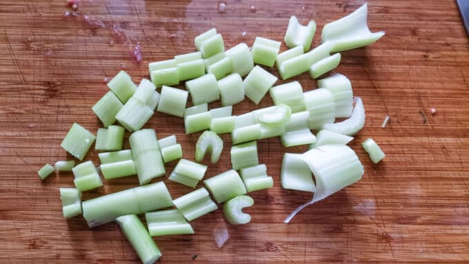Chopped celery on board.