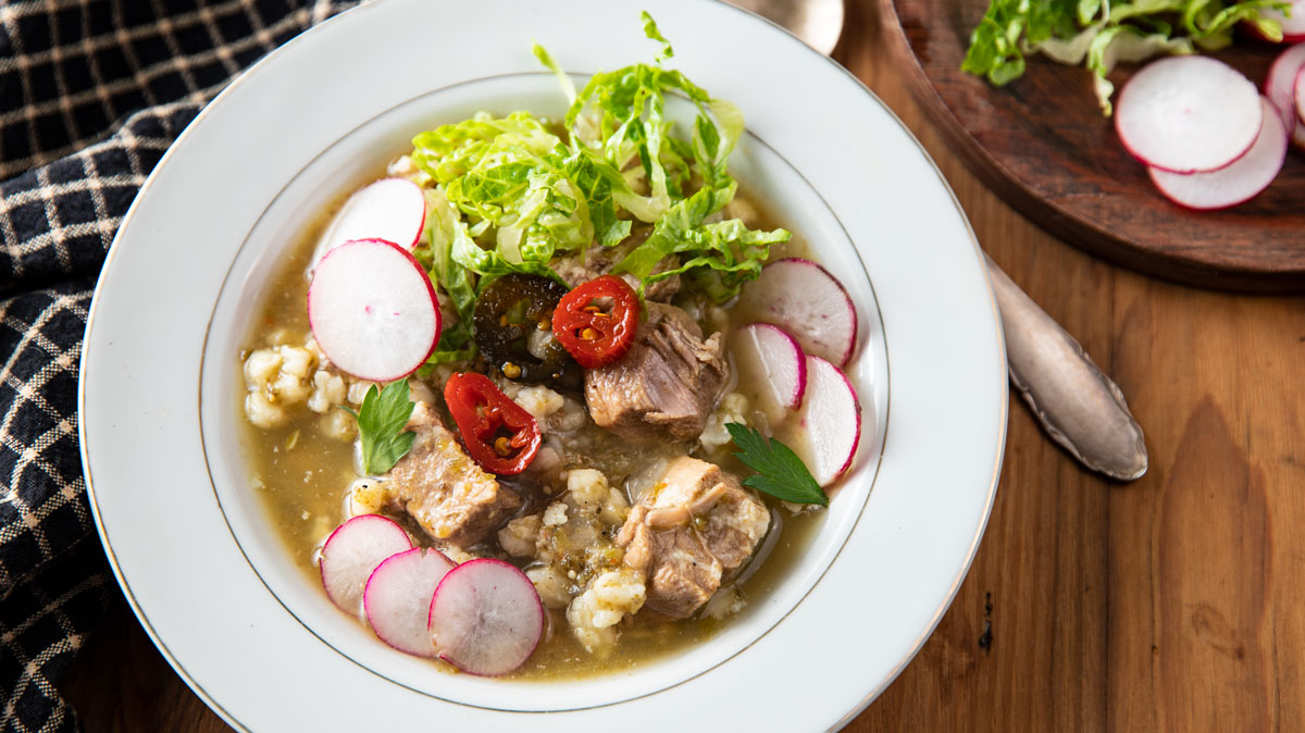 Close up of pork soup with hominy.