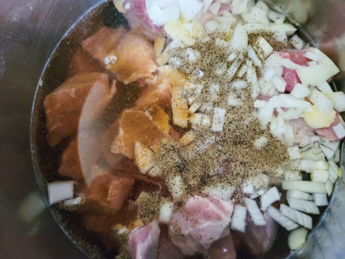 Onions, garlic, and spices added to the pot.
