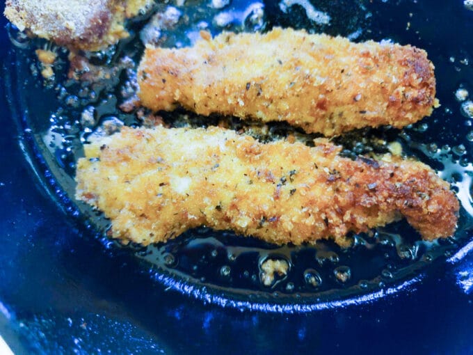 Browned side of loins showing in the cast iron pan.