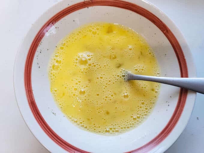 Whisked eggs in a bowl.
